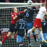 Poland's Kamil Glik scores