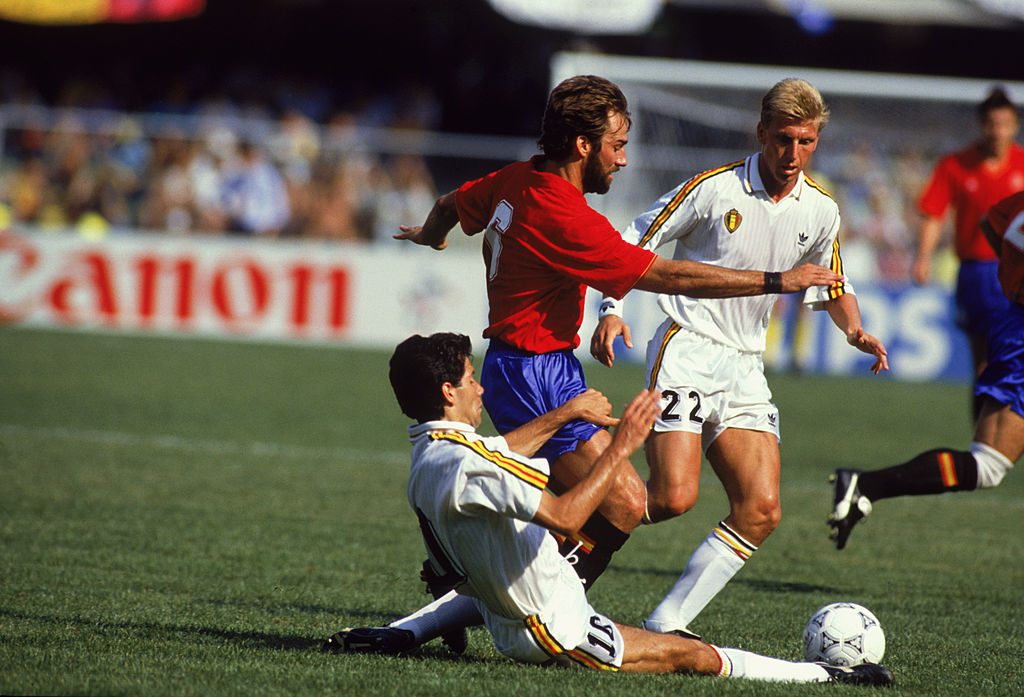 Rafael Martin Vazquez of Spain and Enzo Scifo and Patrick Vervoort of Belgium