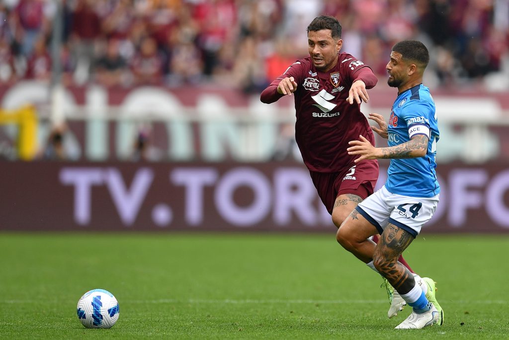 TURIN, ITALY - MAY 07: Armando Izzo of Torino FC is tackled by Lorenzo Insigne of SSC Napoli during the Serie A match between Torino FC and SSC Napoli at Stadio Olimpico di Torino on May 7, 2022 in Turin, Italy. (Photo by Valerio Pennicino/Getty Images)
