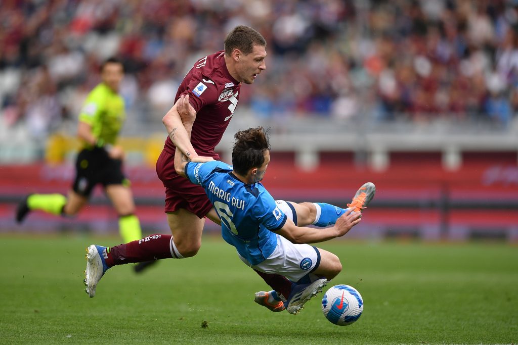 TURIN, ITALY - MAY 07: Andrea Belotti of Torino FC is tackled by Mario Rui of SSC Napoli during the Serie A match between Torino FC and SSC Napoli at Stadio Olimpico di Torino on May 7, 2022 in Turin, Italy. (Photo by Valerio Pennicino/Getty Images)